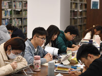 College students are reviewing for exams at the library of Nanjing Forestry University in Nanjing, China, on December 7, 2023. (