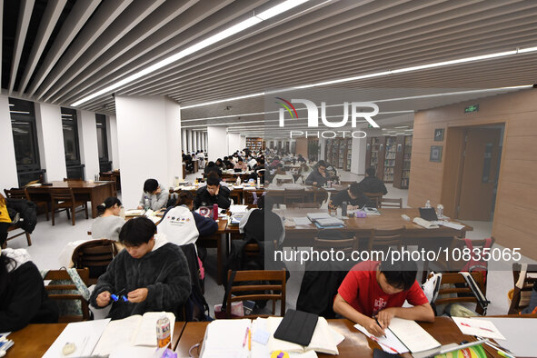 College students are reviewing for exams at the library of Nanjing Forestry University in Nanjing, China, on December 7, 2023. 