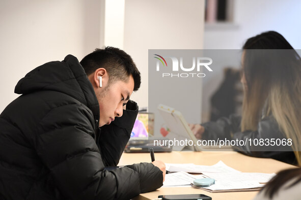 College students are reviewing for exams at the library of Nanjing Forestry University in Nanjing, China, on December 7, 2023. 