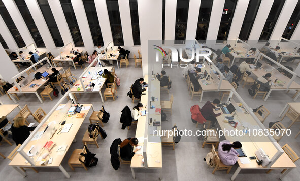 College students are reviewing for exams at the library of Nanjing Forestry University in Nanjing, China, on December 7, 2023. 