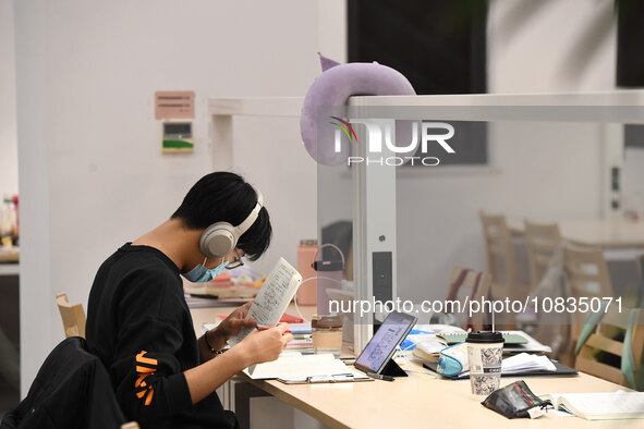 College students are reviewing for exams at the library of Nanjing Forestry University in Nanjing, China, on December 7, 2023. 