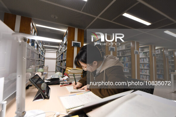 College students are reviewing for exams at the library of Nanjing Forestry University in Nanjing, China, on December 7, 2023. 