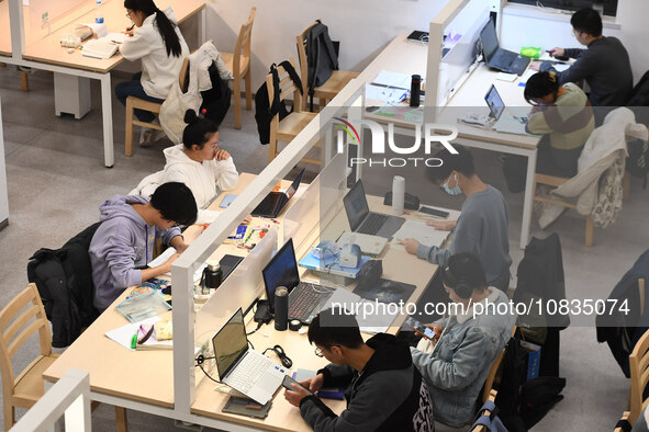 College students are reviewing for exams at the library of Nanjing Forestry University in Nanjing, China, on December 7, 2023. 