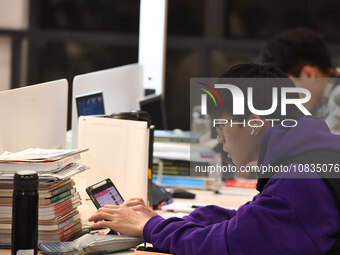 College students are reviewing for exams at the library of Nanjing Forestry University in Nanjing, China, on December 7, 2023. (