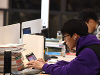 College students are reviewing for exams at the library of Nanjing Forestry University in Nanjing, China, on December 7, 2023. (