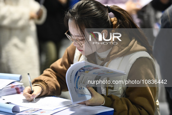 College student job seekers are communicating with representatives of employers at a college employment fair in Fuyang, Anhui Province, Chin...