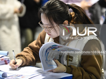 College student job seekers are communicating with representatives of employers at a college employment fair in Fuyang, Anhui Province, Chin...