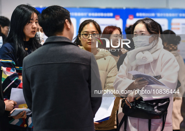 College student job seekers are communicating with representatives of employers at a college employment fair in Fuyang, Anhui Province, Chin...