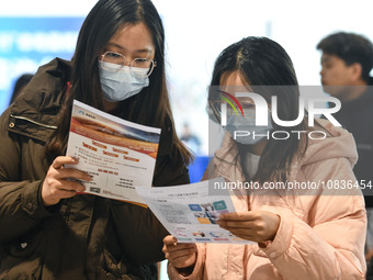 College student job seekers are communicating with representatives of employers at a college employment fair in Fuyang, Anhui Province, Chin...