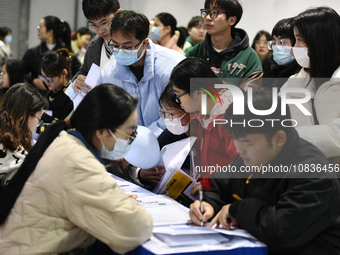 College student job seekers are communicating with representatives of employers at a college employment fair in Fuyang, Anhui Province, Chin...