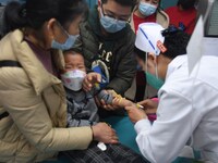 Parents are taking their children for infusion treatment at a hospital in Shenyang, Liaoning province, China, on December 8, 2023. (