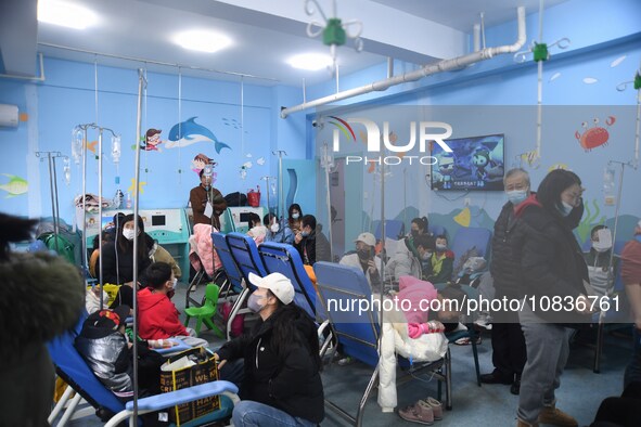 Parents are taking their children for infusion treatment at a hospital in Shenyang, Liaoning province, China, on December 8, 2023. 