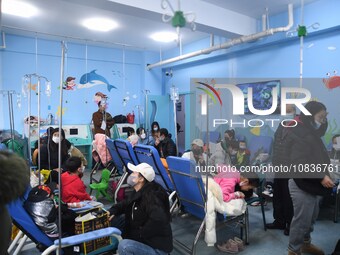 Parents are taking their children for infusion treatment at a hospital in Shenyang, Liaoning province, China, on December 8, 2023. (