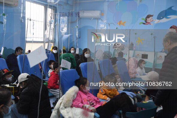 Parents are taking their children for infusion treatment at a hospital in Shenyang, Liaoning province, China, on December 8, 2023. 