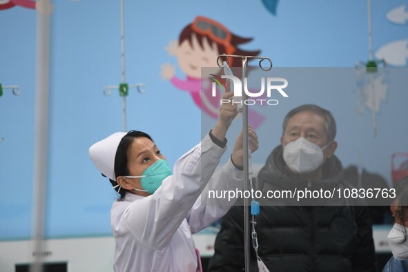 Parents are taking their children for infusion treatment at a hospital in Shenyang, Liaoning province, China, on December 8, 2023. 