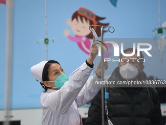 Parents are taking their children for infusion treatment at a hospital in Shenyang, Liaoning province, China, on December 8, 2023. (