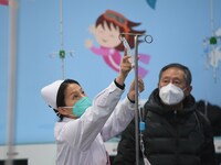 Parents are taking their children for infusion treatment at a hospital in Shenyang, Liaoning province, China, on December 8, 2023. (