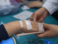 Parents are taking their children for infusion treatment at a hospital in Shenyang, Liaoning province, China, on December 8, 2023. (