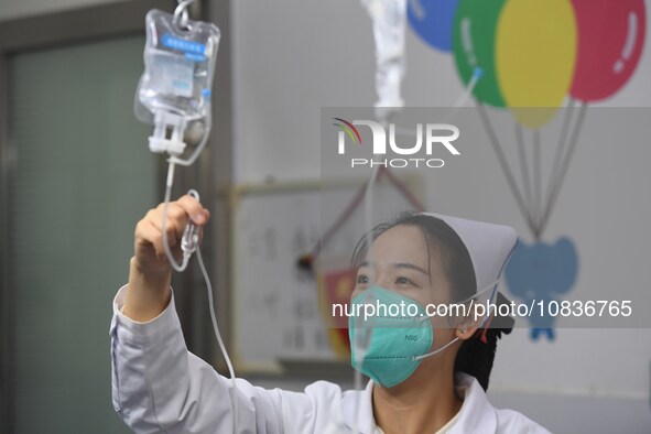 Parents are taking their children for infusion treatment at a hospital in Shenyang, Liaoning province, China, on December 8, 2023. 