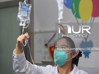 Parents are taking their children for infusion treatment at a hospital in Shenyang, Liaoning province, China, on December 8, 2023. (