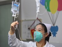 Parents are taking their children for infusion treatment at a hospital in Shenyang, Liaoning province, China, on December 8, 2023. (