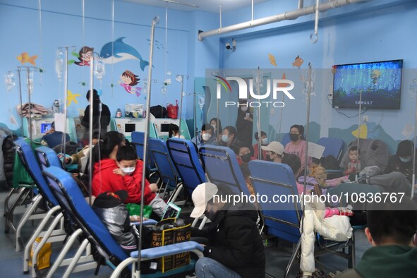 Parents are taking their children for infusion treatment at a hospital in Shenyang, Liaoning province, China, on December 8, 2023. 