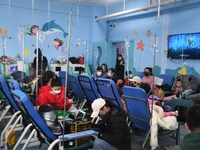 Parents are taking their children for infusion treatment at a hospital in Shenyang, Liaoning province, China, on December 8, 2023. (