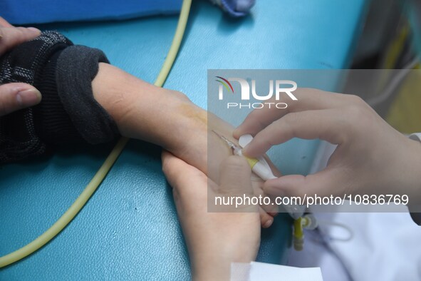 Parents are taking their children for infusion treatment at a hospital in Shenyang, Liaoning province, China, on December 8, 2023. 