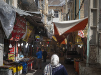 An Iranian woman is walking through a bazaar while visiting the flooded village of Imamzadeh Davood in the northwestern part of Tehran, Iran...