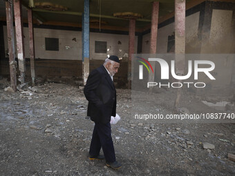 An elderly Iranian man is walking past a destroyed shop while visiting the flooded village of Imamzadeh Davood in the northwestern part of T...