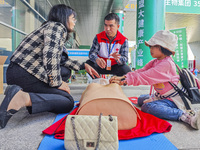 Participants are practicing cardiopulmonary resuscitation (CPR) at the 2023 China-ASEAN Health Industry Summit in Nanning, Guangxi, China, o...