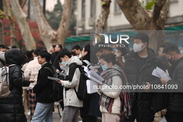 Candidates are waiting to enter the written exam of the Jiangsu 2024 civil servant exam in Nanjing, Jiangsu Province, China, on December 10,...