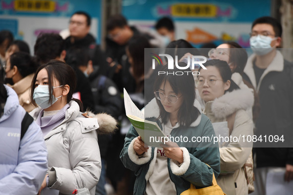 Candidates are waiting to enter the written exam of the Jiangsu 2024 civil servant exam in Nanjing, Jiangsu Province, China, on December 10,...