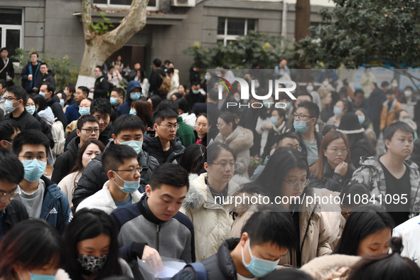 Candidates are waiting to enter the written exam of the Jiangsu 2024 civil servant exam in Nanjing, Jiangsu Province, China, on December 10,...