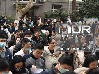 Candidates are waiting to enter the written exam of the Jiangsu 2024 civil servant exam in Nanjing, Jiangsu Province, China, on December 10,...