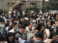 Candidates are waiting to enter the written exam of the Jiangsu 2024 civil servant exam in Nanjing, Jiangsu Province, China, on December 10,...