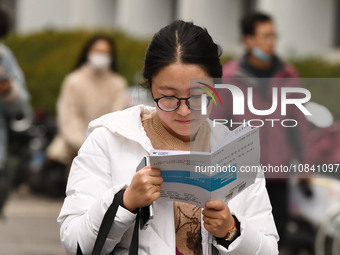 Candidates are waiting to enter the written exam of the Jiangsu 2024 civil servant exam in Nanjing, Jiangsu Province, China, on December 10,...