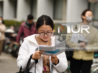 Candidates are waiting to enter the written exam of the Jiangsu 2024 civil servant exam in Nanjing, Jiangsu Province, China, on December 10,...