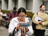 Candidates are waiting to enter the written exam of the Jiangsu 2024 civil servant exam in Nanjing, Jiangsu Province, China, on December 10,...