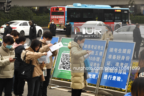 Candidates are waiting to enter the written exam of the Jiangsu 2024 civil servant exam in Nanjing, Jiangsu Province, China, on December 10,...