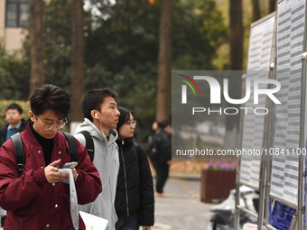 Candidates are waiting to enter the written exam of the Jiangsu 2024 civil servant exam in Nanjing, Jiangsu Province, China, on December 10,...