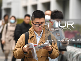 Candidates are waiting to enter the written exam of the Jiangsu 2024 civil servant exam in Nanjing, Jiangsu Province, China, on December 10,...