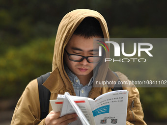 Candidates are waiting to enter the written exam of the Jiangsu 2024 civil servant exam in Nanjing, Jiangsu Province, China, on December 10,...