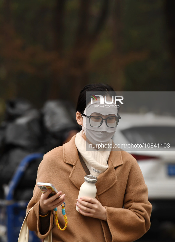 Candidates are waiting to enter the written exam of the Jiangsu 2024 civil servant exam in Nanjing, Jiangsu Province, China, on December 10,...