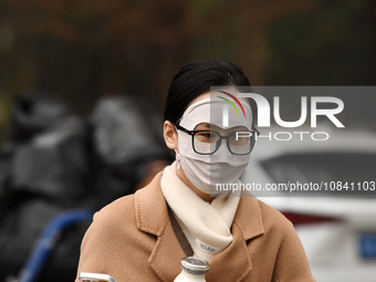 Candidates are waiting to enter the written exam of the Jiangsu 2024 civil servant exam in Nanjing, Jiangsu Province, China, on December 10,...