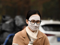 Candidates are waiting to enter the written exam of the Jiangsu 2024 civil servant exam in Nanjing, Jiangsu Province, China, on December 10,...