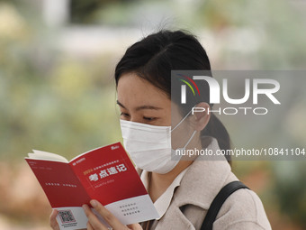 Candidates are waiting to enter the written exam of the Jiangsu 2024 civil servant exam in Nanjing, Jiangsu Province, China, on December 10,...