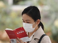 Candidates are waiting to enter the written exam of the Jiangsu 2024 civil servant exam in Nanjing, Jiangsu Province, China, on December 10,...