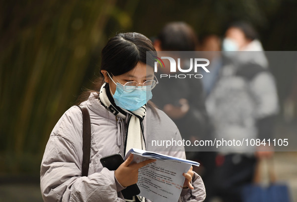 Candidates are waiting to enter the written exam of the Jiangsu 2024 civil servant exam in Nanjing, Jiangsu Province, China, on December 10,...