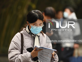 Candidates are waiting to enter the written exam of the Jiangsu 2024 civil servant exam in Nanjing, Jiangsu Province, China, on December 10,...